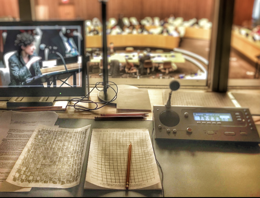 Interpreter workstation overlooking a conference chamber at the United Nations